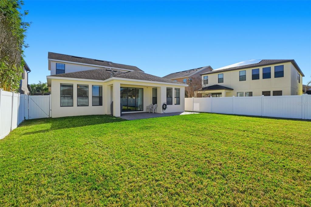 1154 Fountain Coin Loop Orlando, FL 32828 - Photo 36 of 48 a front view of a house with garden