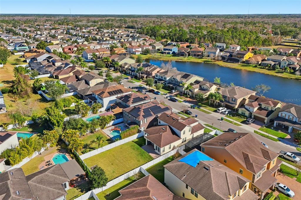 1154 Fountain Coin Loop Orlando, FL 32828 - Photo 44 of 48 an aerial view of a houses with a lake