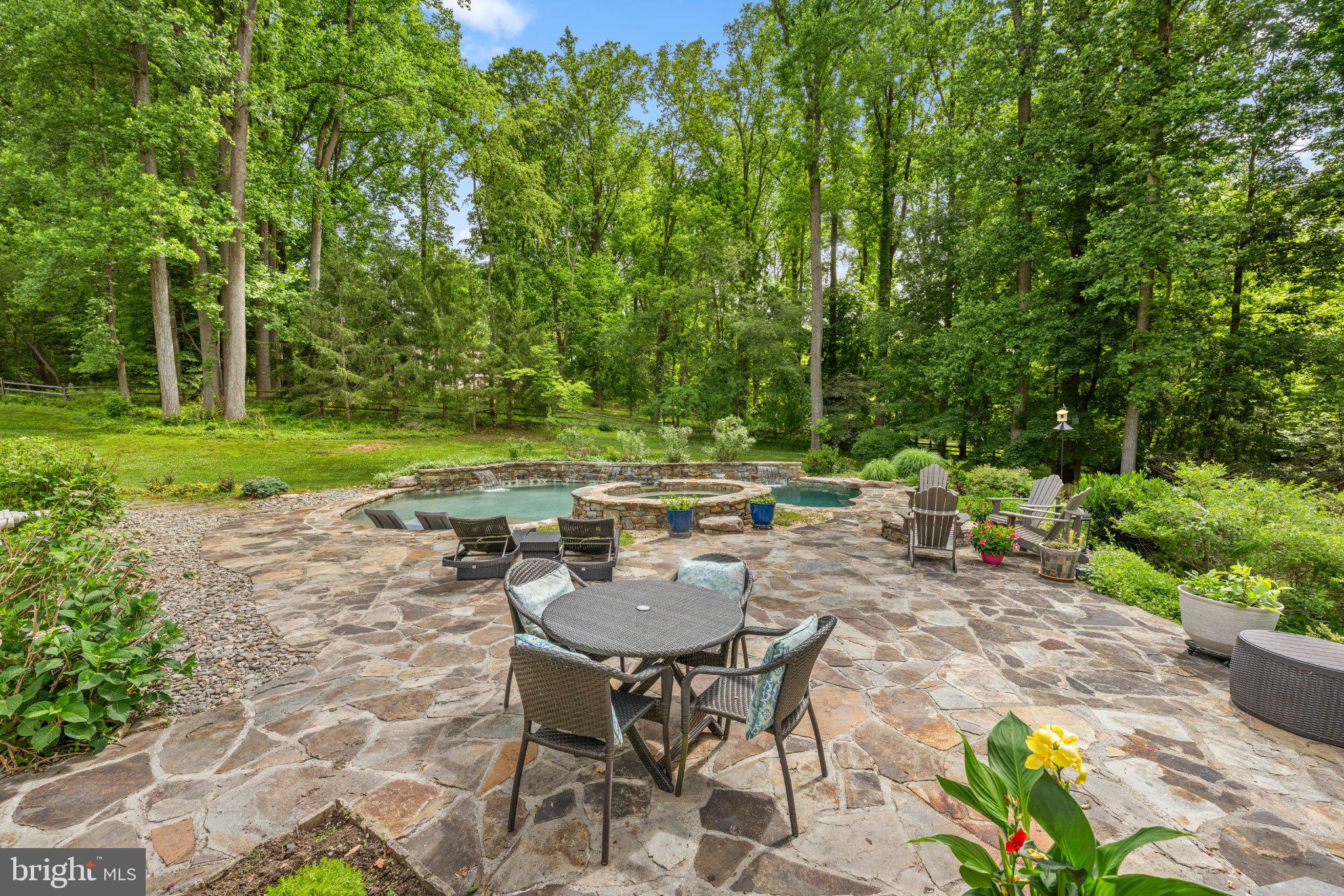 429 Church Road Devon, PA 19333 - Photo 51 of 55 Serene backyard oasis with lush greenery.