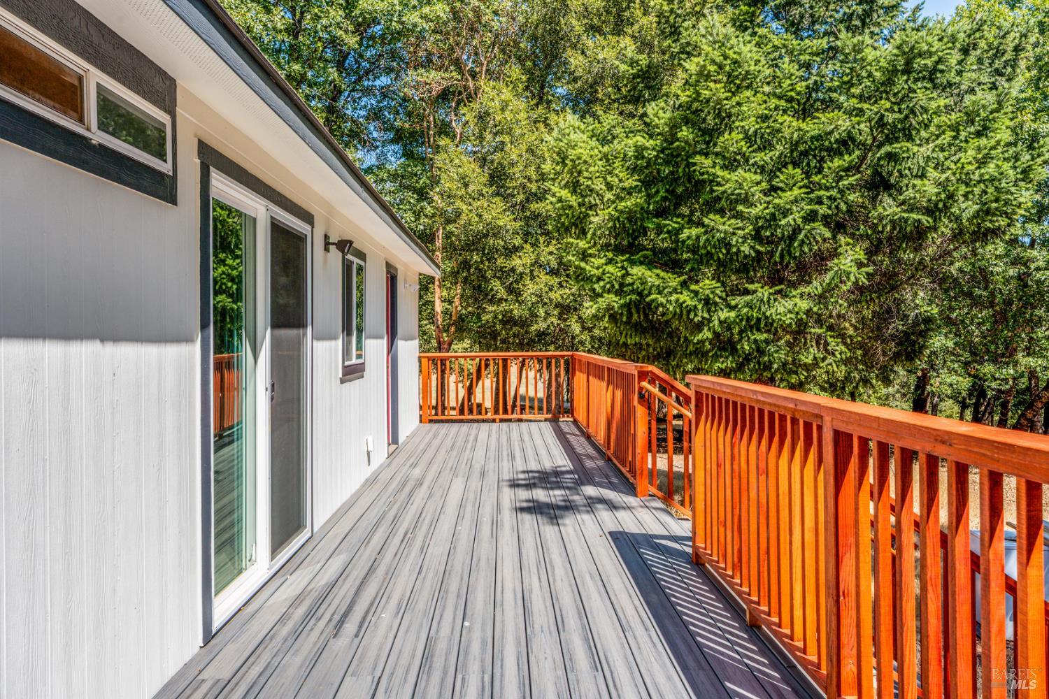 a view of balcony with wooden floor