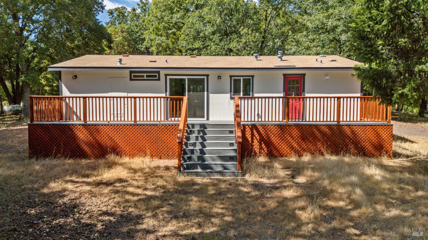 78611 Mina Road Covelo, CA 95428 - Photo 14 of 24 a view of a house with a yard and wooden fence