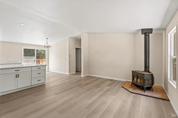 a view of a kitchen with a sink and a window
