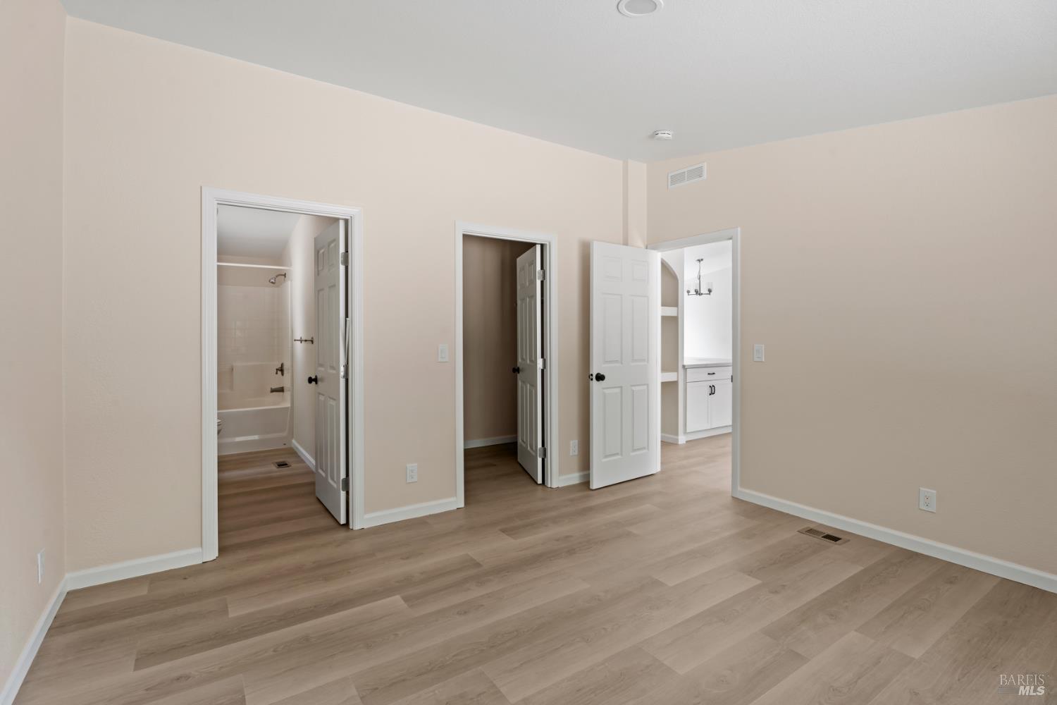 78611 Mina Road Covelo, CA 95428 - Photo 7 of 24 a view of an empty room with wooden floor and a window
