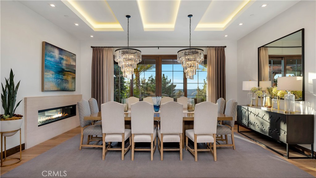2 Thomas Road Ladera Ranch, CA 92694 - Photo 13 of 69 Imagine the dinners you could hold in this magnificent dining room--all while looking at a spectacular view! The recessed lighting on the coffered ceiling and the crystal chandeliers complete the picture. Did you know that every light fixture in the house was placed to exactly enhance the view beyond the fixture itself.