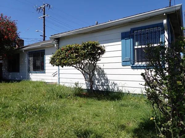 a view of a house with a small yard