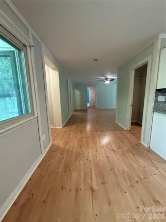 a view of a livingroom with wooden floor