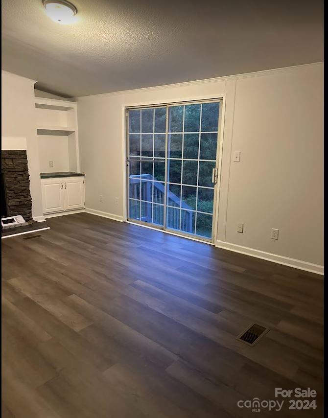 1770 Dark Corner Road Rutherfordton, NC 28139 - Photo 11 of 26 an empty room with wooden floor and windows