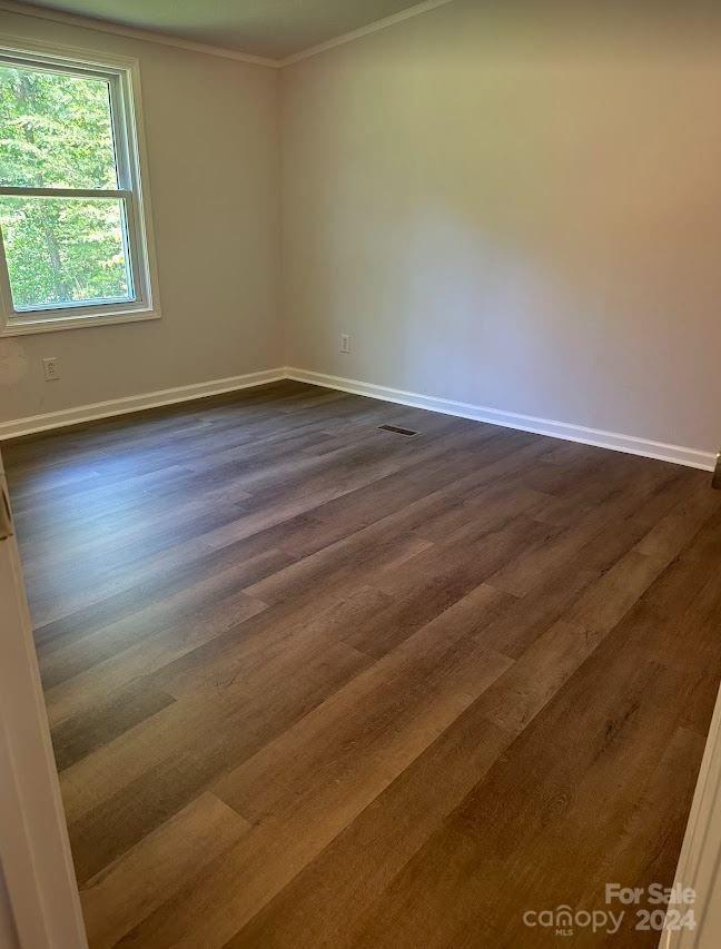1770 Dark Corner Road Rutherfordton, NC 28139 - Photo 20 of 26 an empty room with wooden floor and windows
