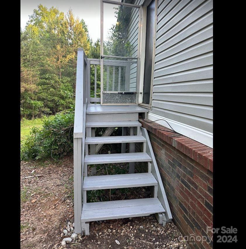 1770 Dark Corner Road Rutherfordton, NC 28139 - Photo 23 of 26 a view of a balcony with furniture and wooden floor