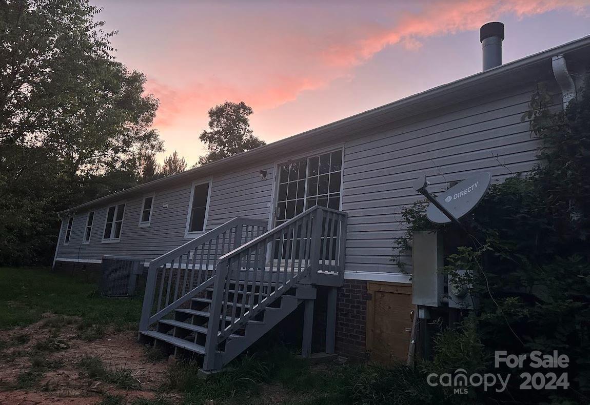 1770 Dark Corner Road Rutherfordton, NC 28139 - Photo 24 of 26 a view of a house with a deck and backyard