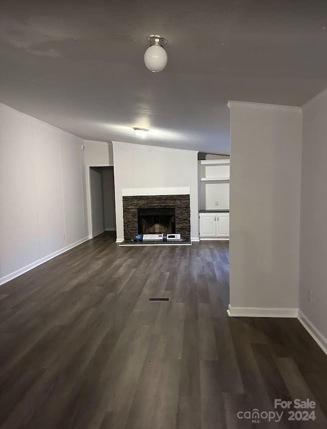 1770 Dark Corner Road Rutherfordton, NC 28139 - Photo 10 of 26 an empty room with wooden floor fireplace and windows