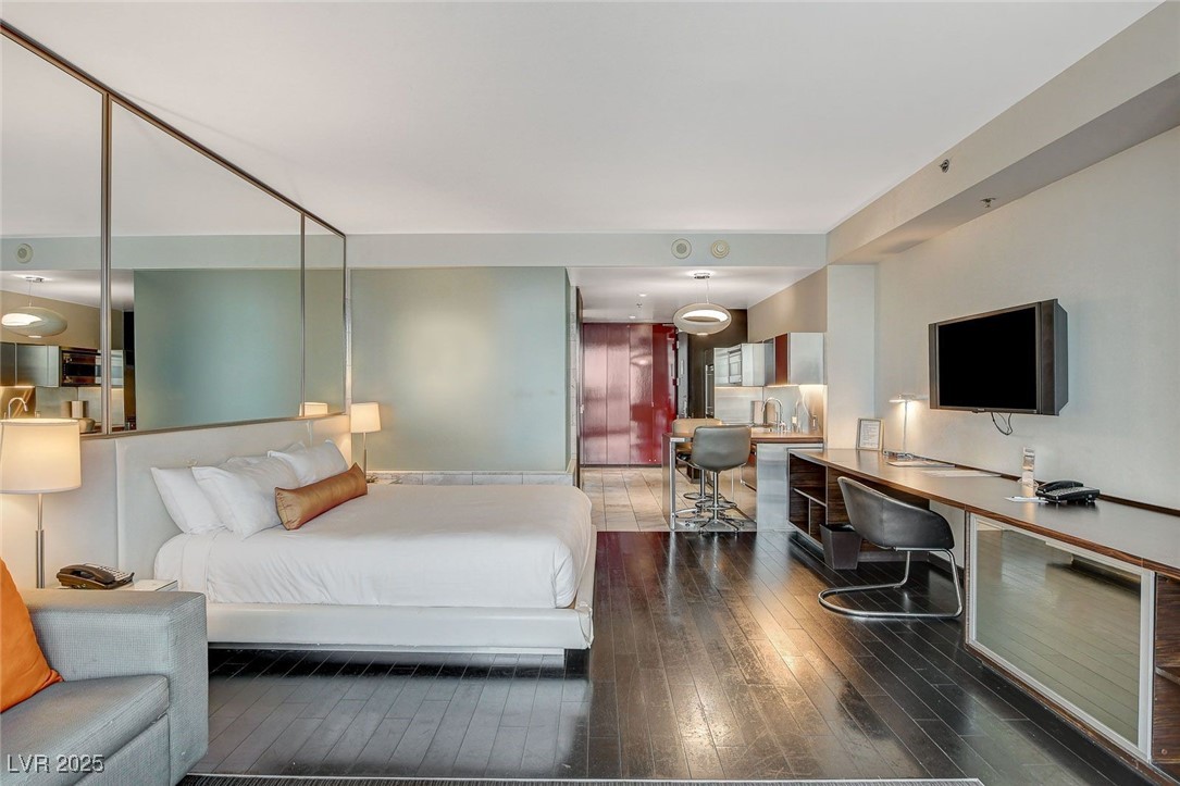 4381 West Flamingo Road, Unit 2204 Las Vegas, NV 89103 - Photo 6 of 27 Bedroom with hardwood / wood-style floors