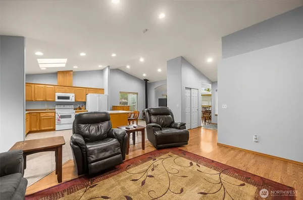 a living room with furniture and a rug