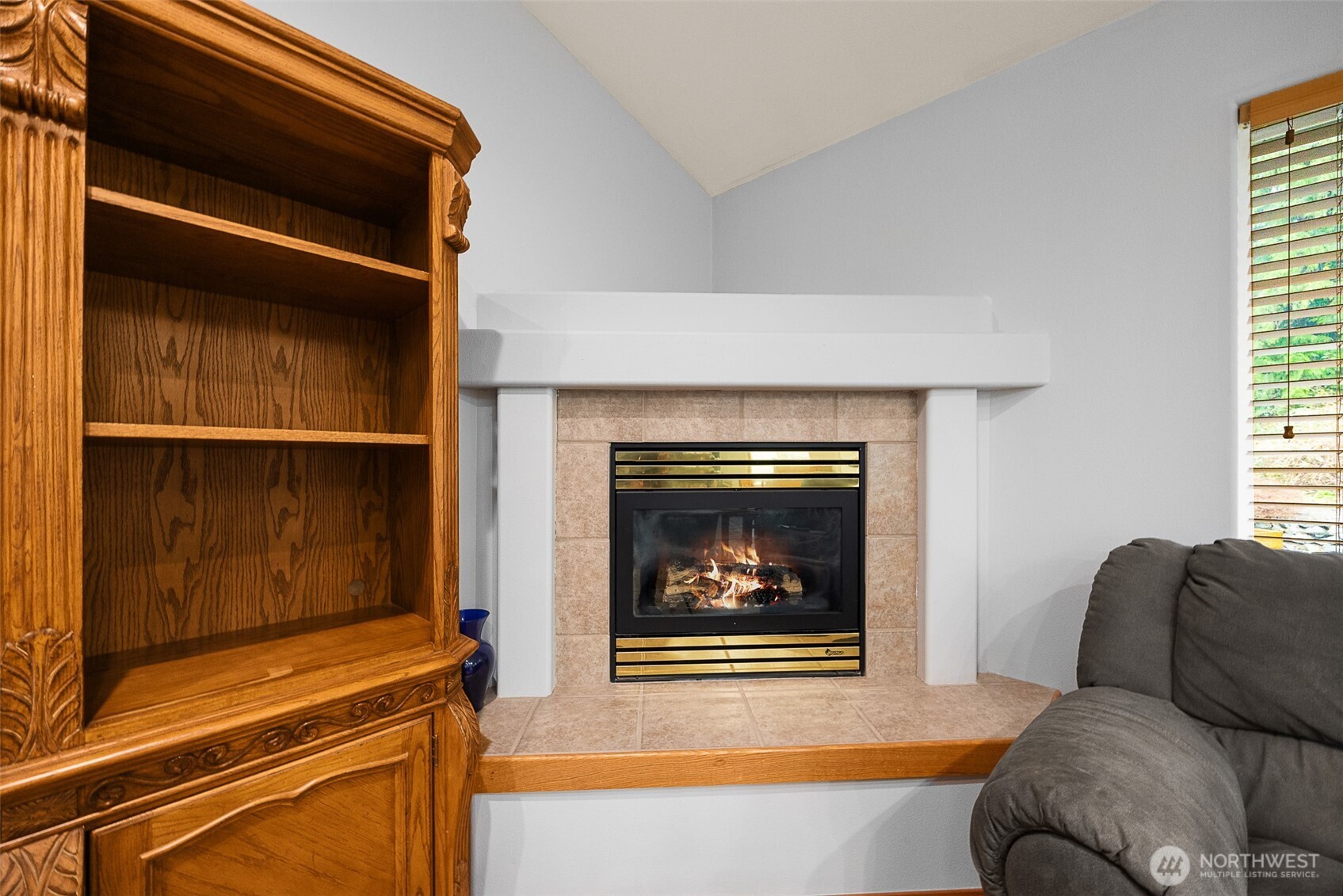 16617 Jim Creek Road Arlington, WA 98223 - Photo 14 of 40 a living room with furniture and a fireplace