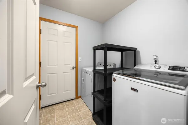 a kitchen with a sink and a refrigerator