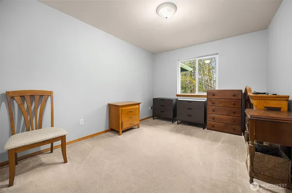 a livingroom with a workspace