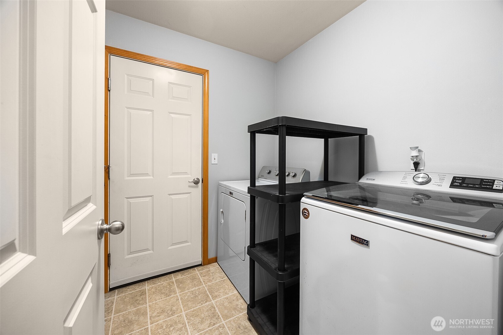 16617 Jim Creek Road Arlington, WA 98223 - Photo 18 of 40 a kitchen with a sink and a refrigerator