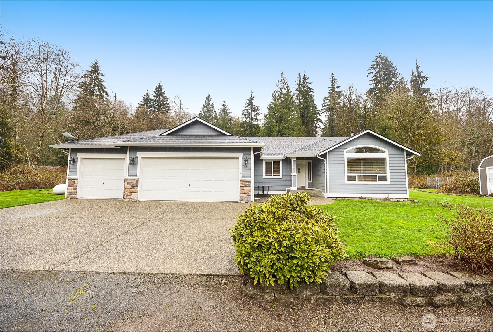 16617 Jim Creek Road Arlington, WA 98223 - Photo 2 of 40 a front view of a house with a yard and garage