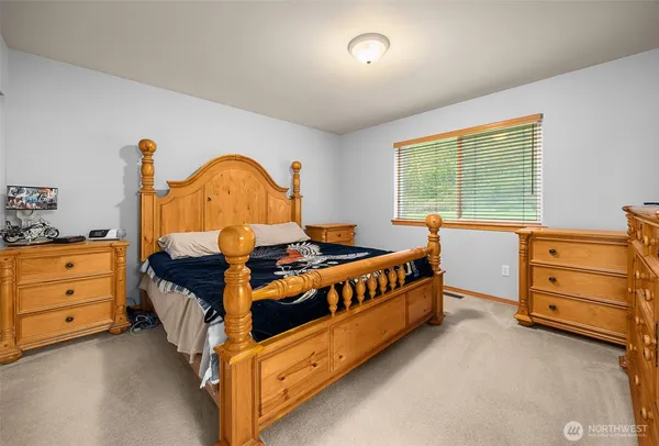a bed room with a bed and a dresser