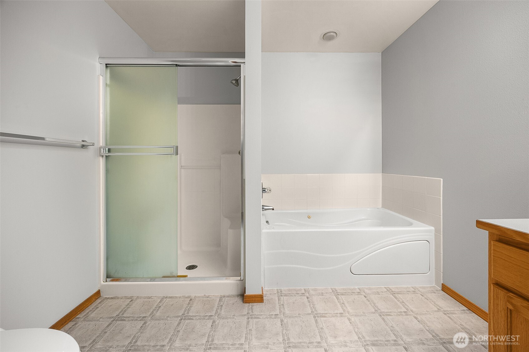 16617 Jim Creek Road Arlington, WA 98223 - Photo 25 of 40 a bathroom with a bathtub and a shower