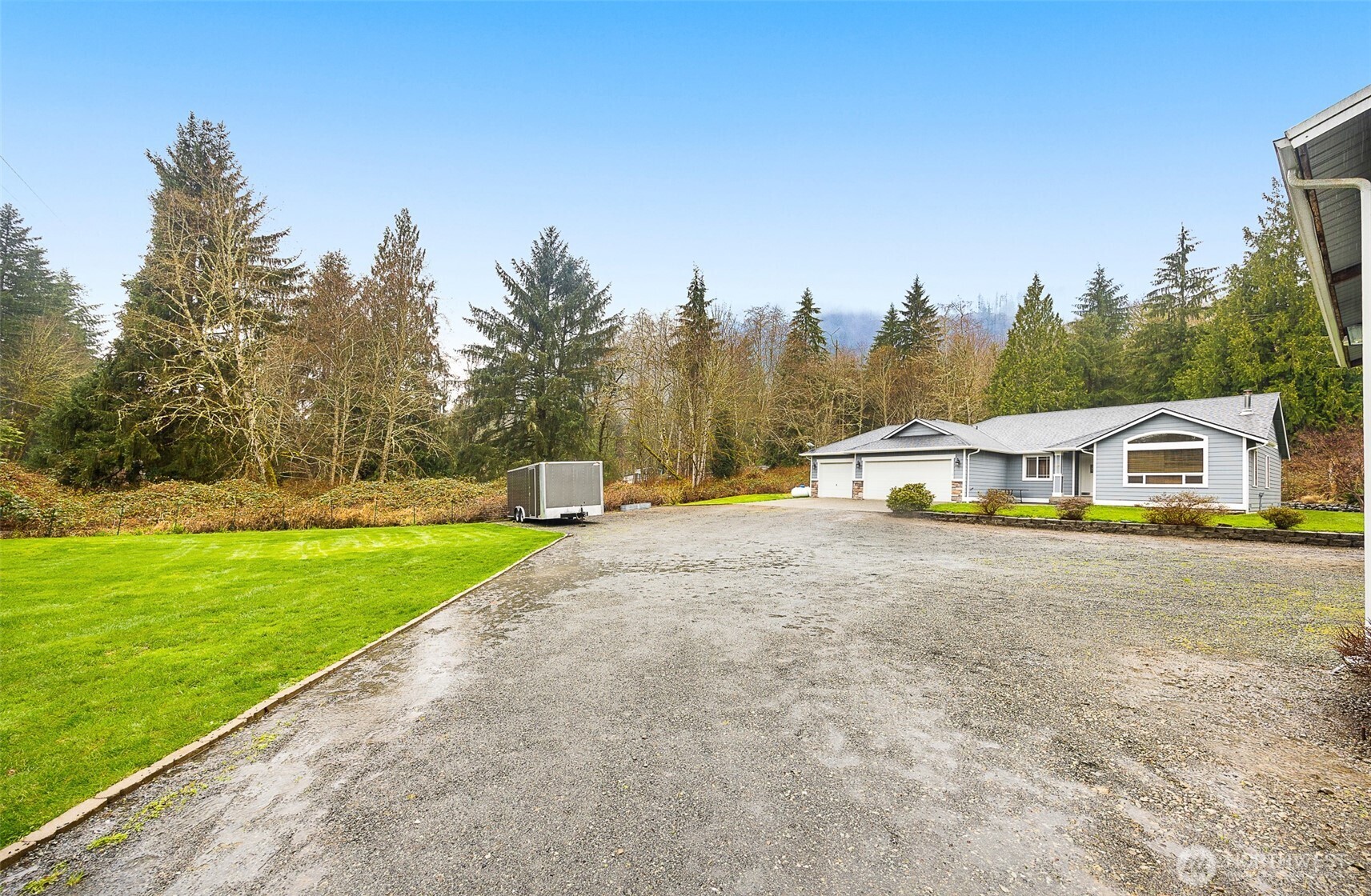 16617 Jim Creek Road Arlington, WA 98223 - Photo 28 of 40 a view of a house with a yard