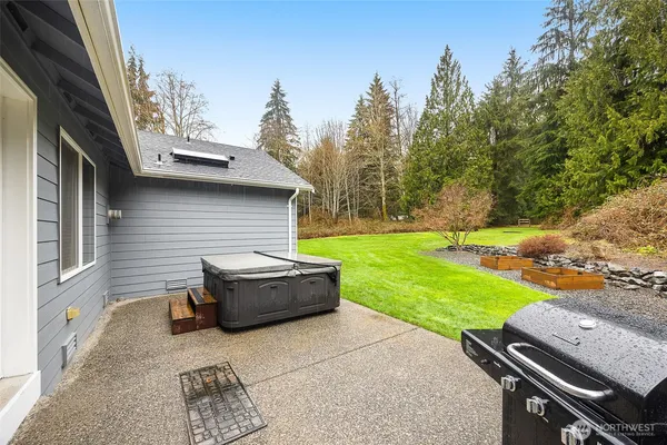a backyard of a house with yard and outdoor seating