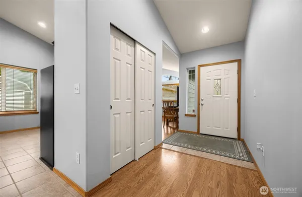 a view of hallway with wooden floor