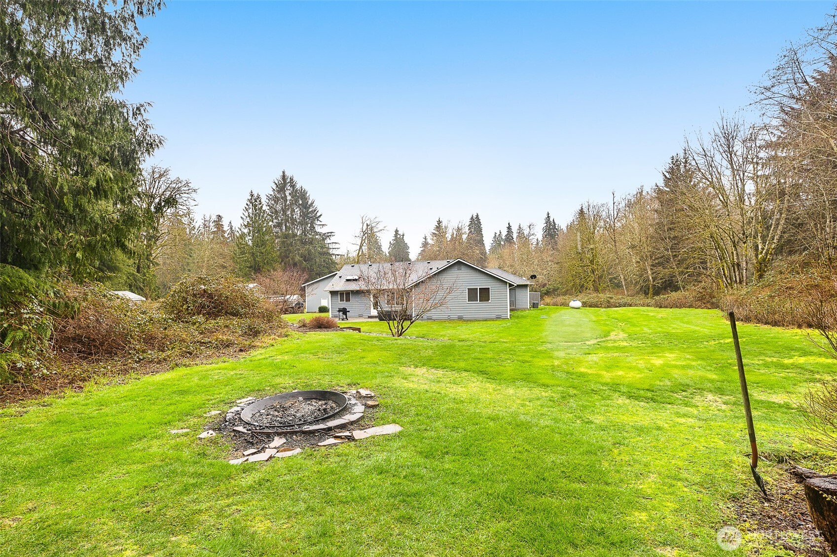 16617 Jim Creek Road Arlington, WA 98223 - Photo 34 of 40 a view of a house with backyard and garden