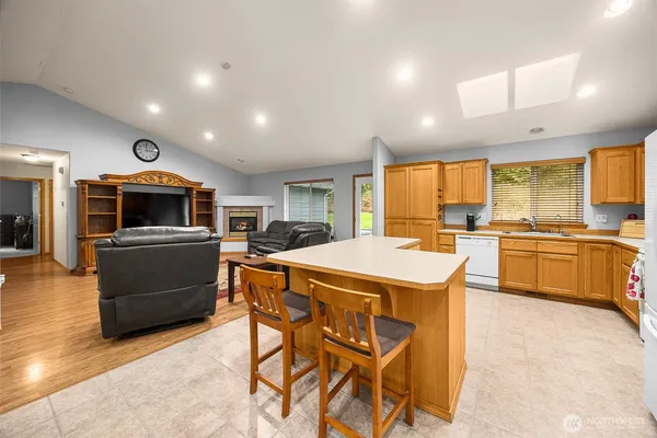 a kitchen with a stove a sink and a refrigerator