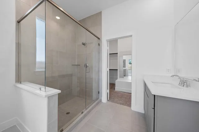 a bathroom with a shower sink and toilet