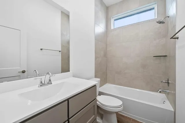 a bathroom with a sink a toilet and a bathtub