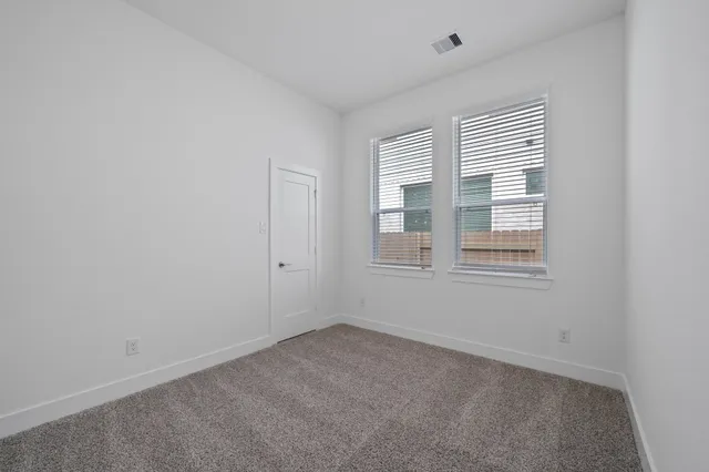 a view of empty room with windows