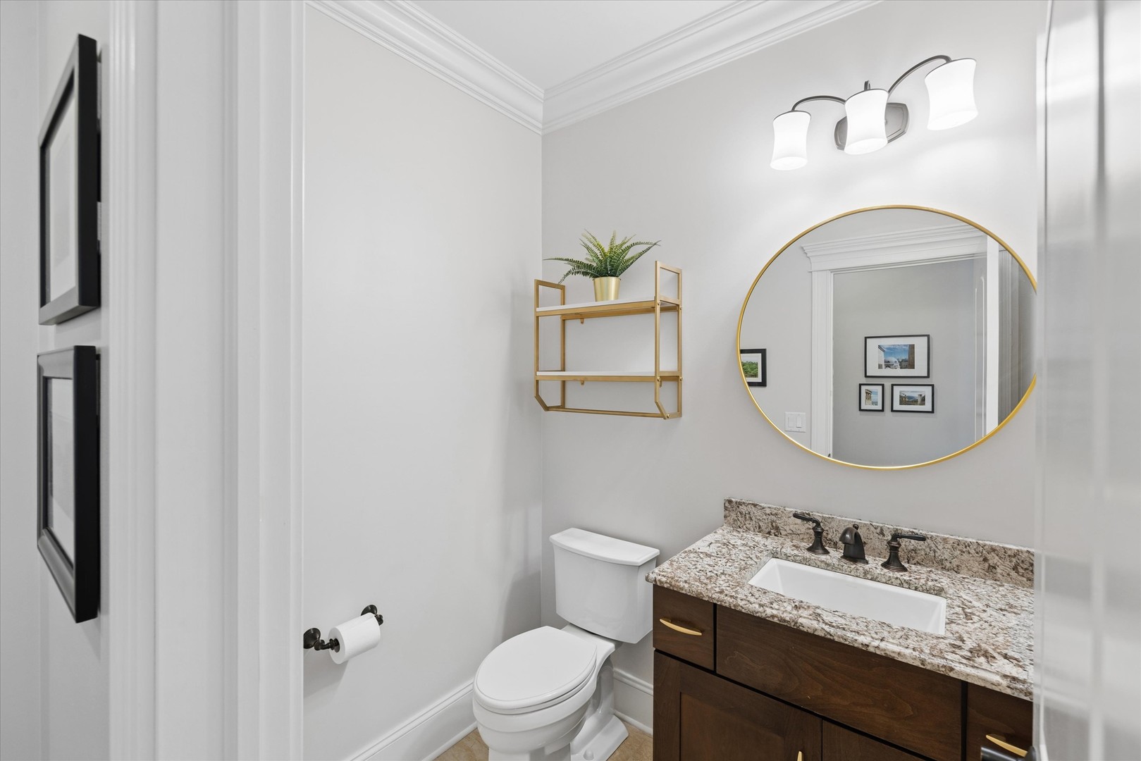 700 Swain Avenue Elmhurst, IL 60126 - Photo 14 of 33 a bathroom with a granite countertop toilet sink and mirror