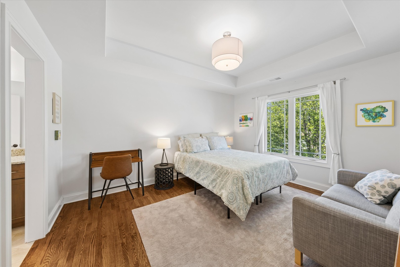700 Swain Avenue Elmhurst, IL 60126 - Photo 17 of 33 a spacious bedroom with a bed and a window