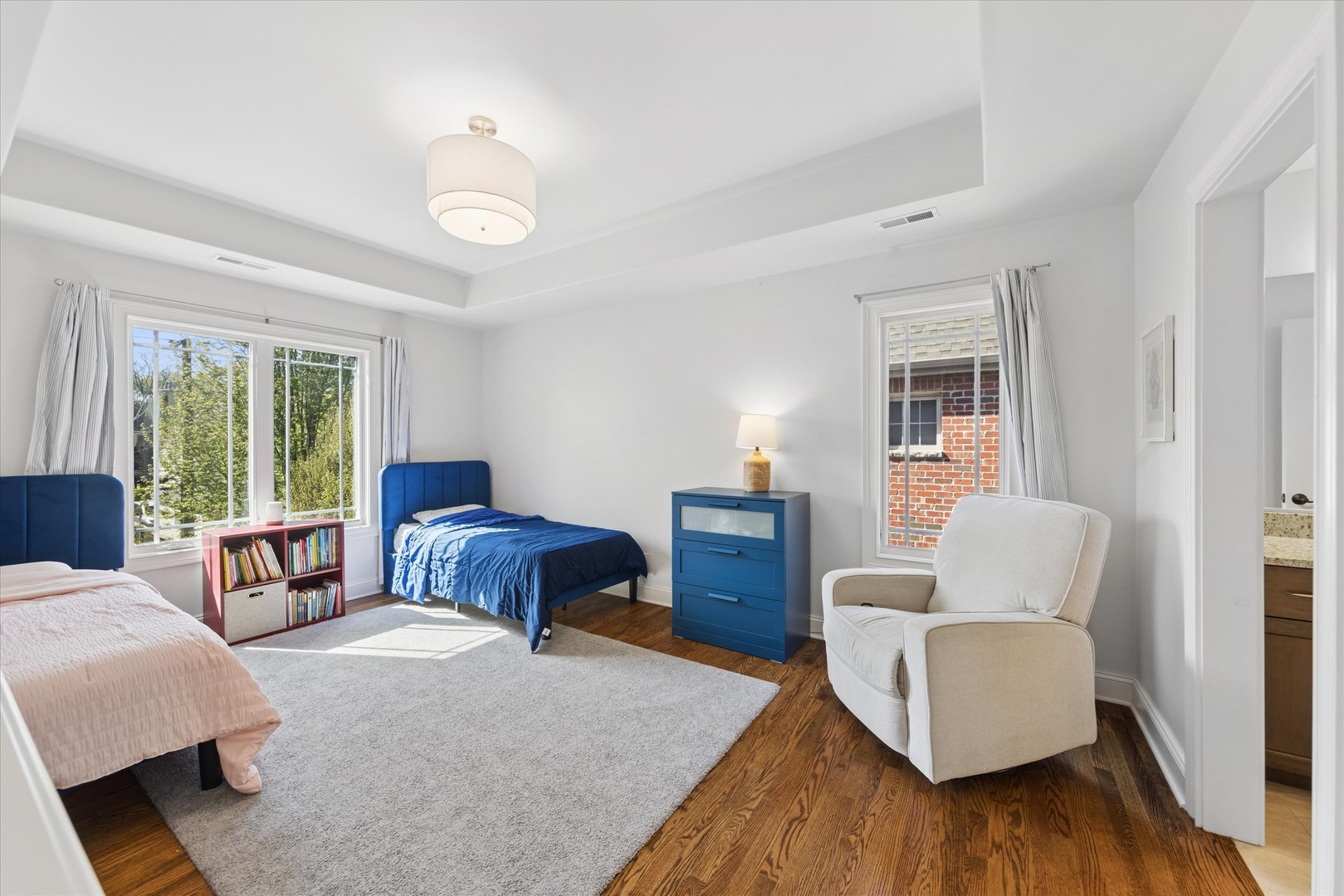 700 Swain Avenue Elmhurst, IL 60126 - Photo 20 of 33 a bedroom with furniture and wooden floor
