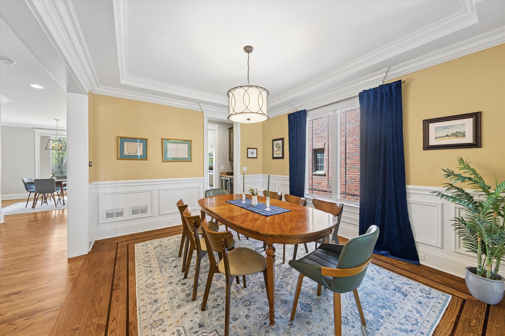 700 Swain Avenue Elmhurst, IL 60126 - Photo 5 of 33 a dining room with furniture a chandelier and wooden floor