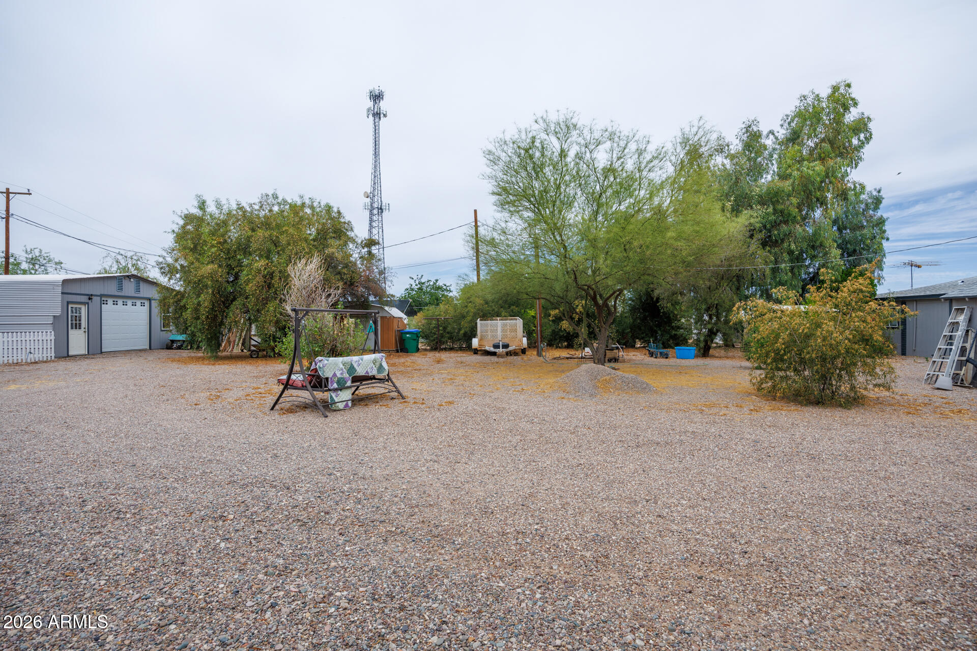6185 East Monitor Street Picacho, AZ 85141 - Photo 12 of 55 a view of a road with a bench and trees