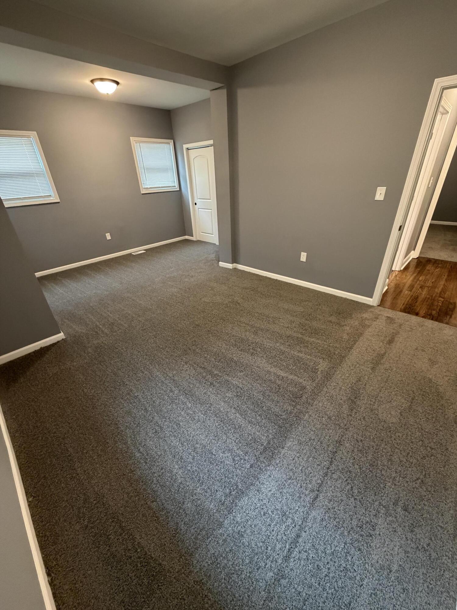 4450 Washington Street Gary, IN 46408 - Photo 14 of 25 en empty room with windows and closet