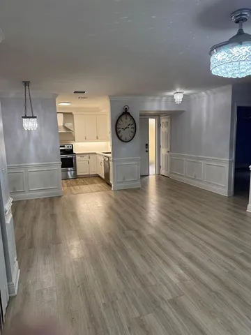 a view of a livingroom with wooden floor