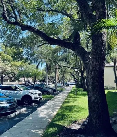 a view of a yard with cars parked