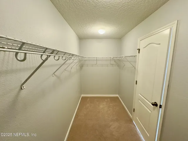 a view of a walk in closet
