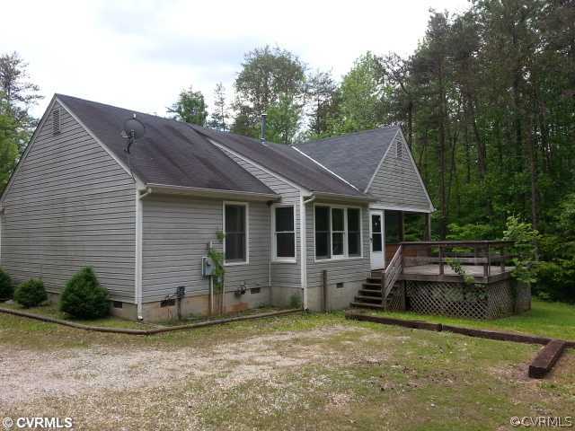3932 Whitehall Road Sandy Hook, VA 23153 - Photo 6 of 6 a view of a house with a yard