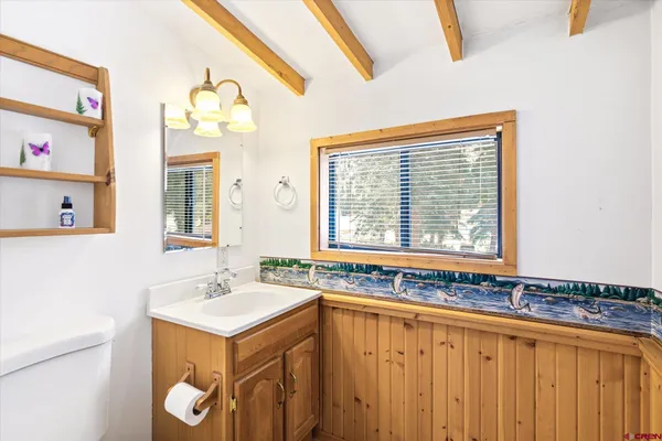 a bathroom with a sink and a window