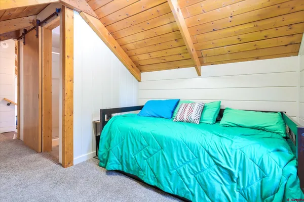 a view of a two chairs in the patio