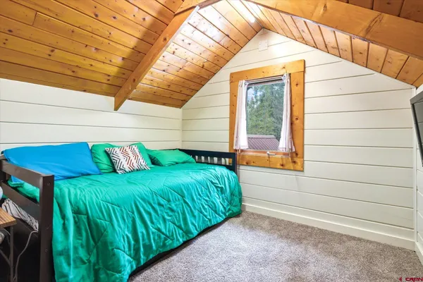 a view of a backyard with a small cabin