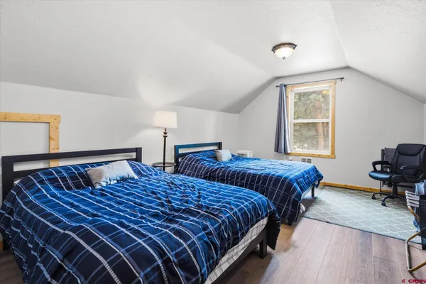 a view of a large and trees in front of house