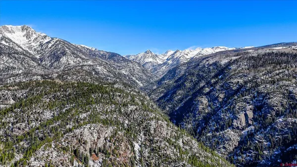 a view of snow on the side of road