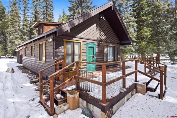 a view of outdoor space with swimming pool and trees