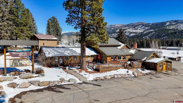 a terrace of a house with outdoor seating