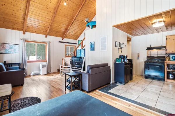 a living room with lots of furniture and appliances